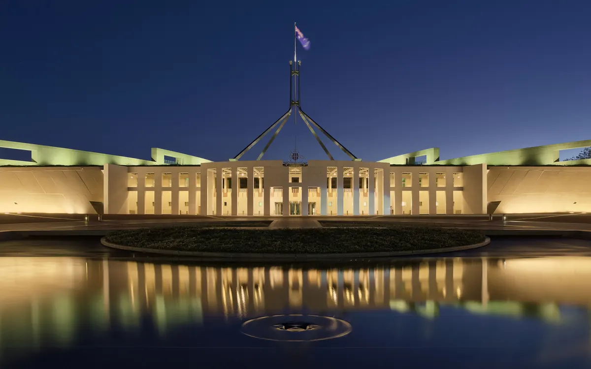 Parliament House in Canberra, Australia, lit up at dusk