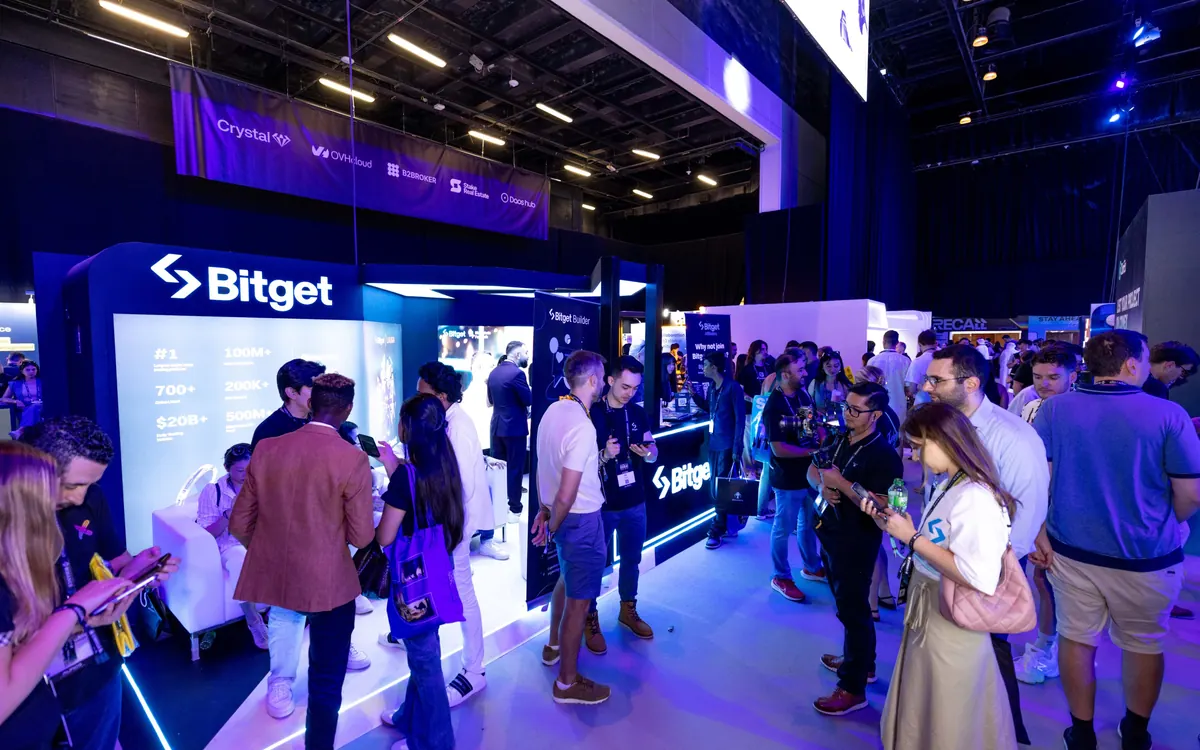 Visitors crowd around a Bitget exhibition booth at a crypto event (illustrative photo)