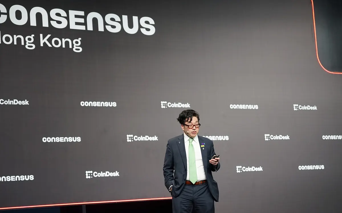Bitmine chairman Tom Lee speaking on stage at Consensus 2026 in Hong Kong