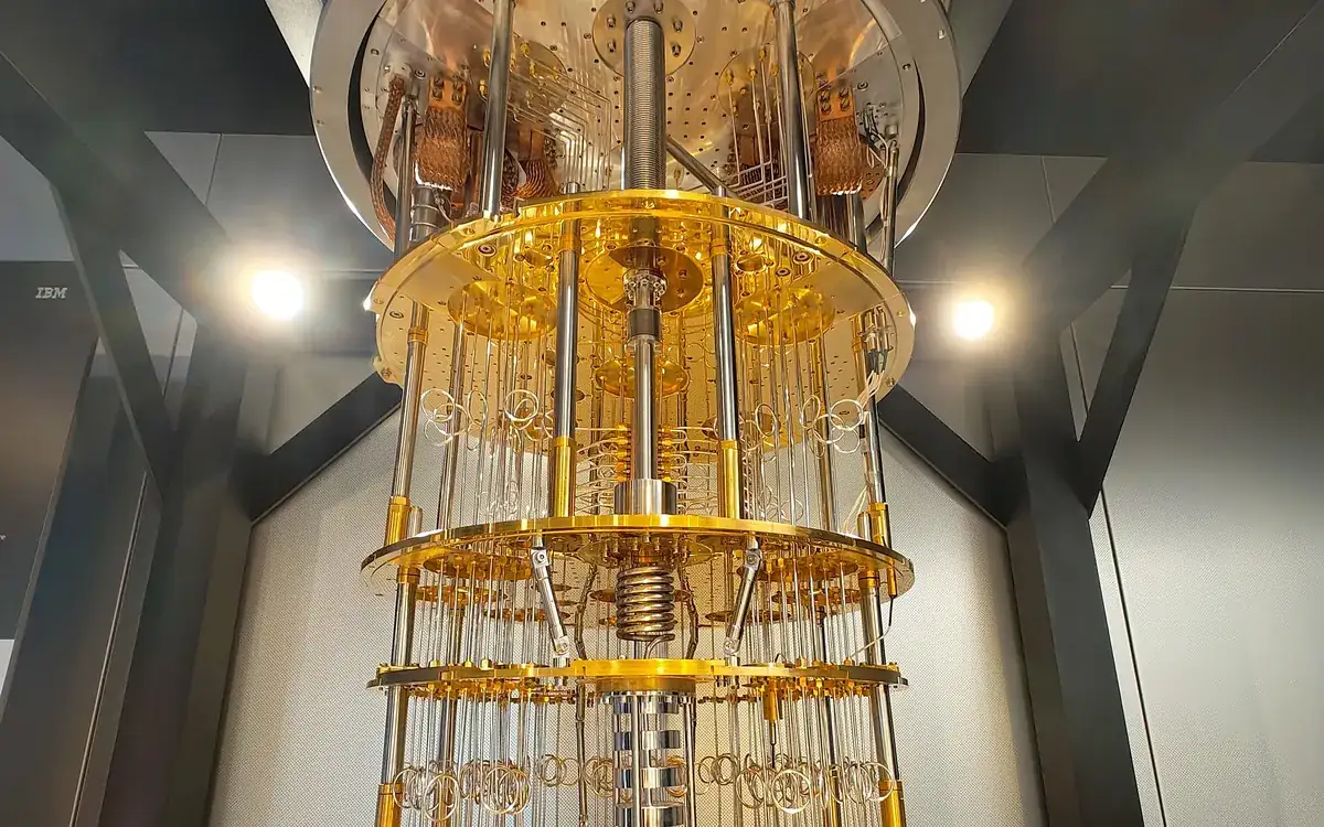 IBM Quantum System One, a quantum computer housed in a glass enclosure (illustrative photo)