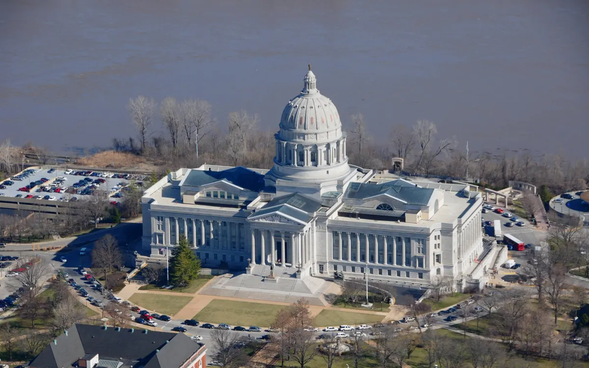Aerial view of the domed Missouri State Capitol in Jefferson City beside the Missouri River (illustrative photo)