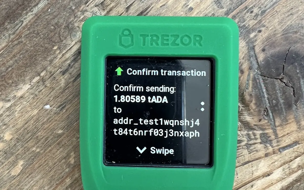 A hardware wallet screen asking the owner to confirm a transaction (illustrative photo, not a Foundation Passport)
