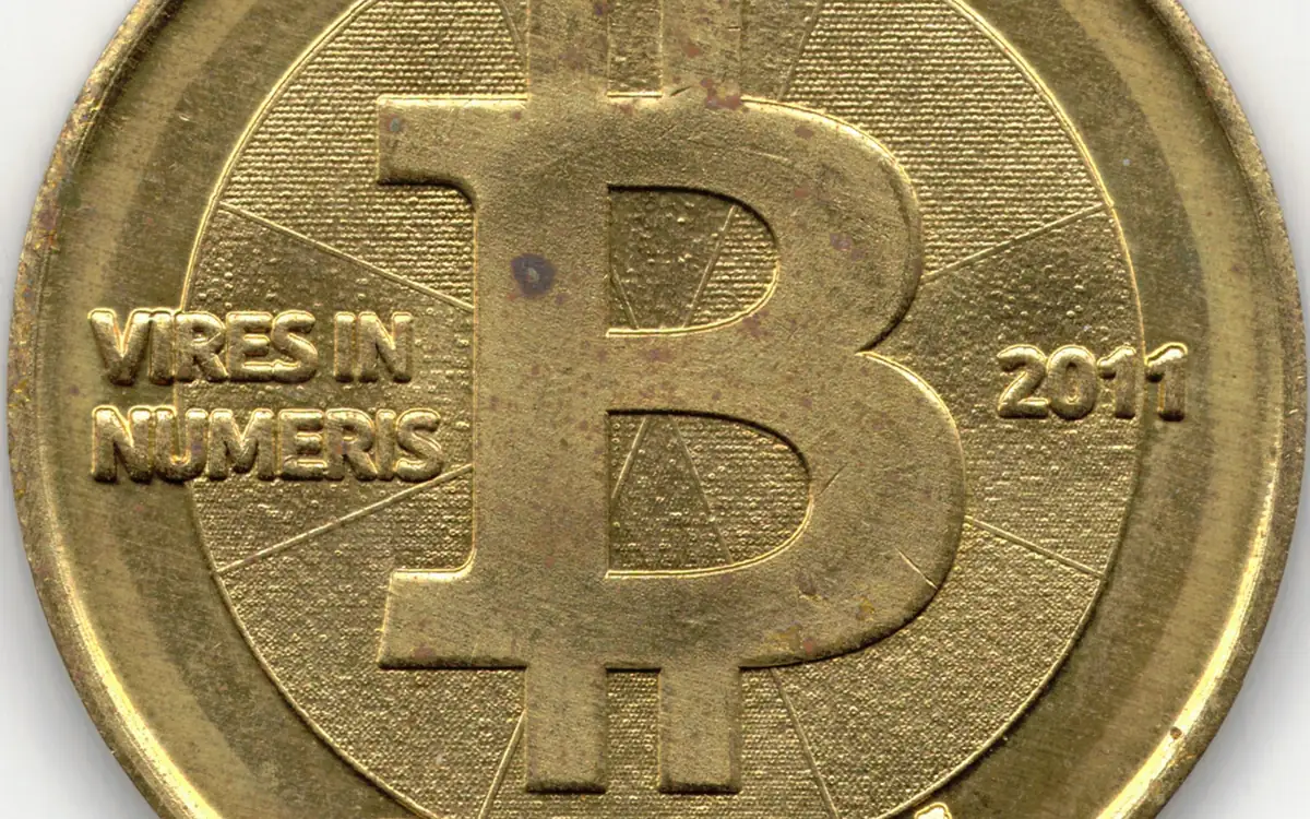 A 2011 Casascius physical bitcoin coin from the network's early years (illustrative photo)