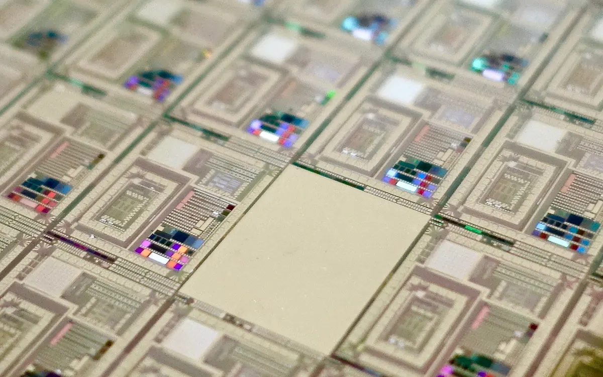 Close-up of a wafer of superconducting quantum processor chips (illustrative photo)