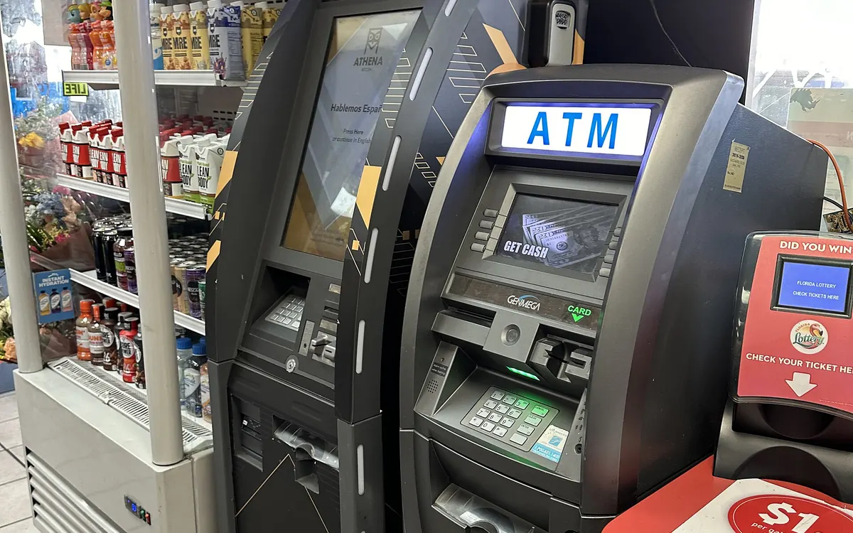 A bitcoin ATM next to a cash ATM inside a gas-station shop in Miami (illustrative photo)