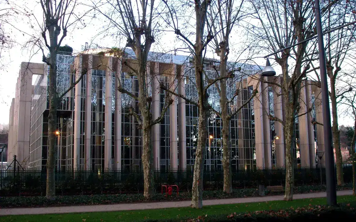 Interpol's General Secretariat headquarters building in Lyon, France, seen through bare trees (illustrative photo)