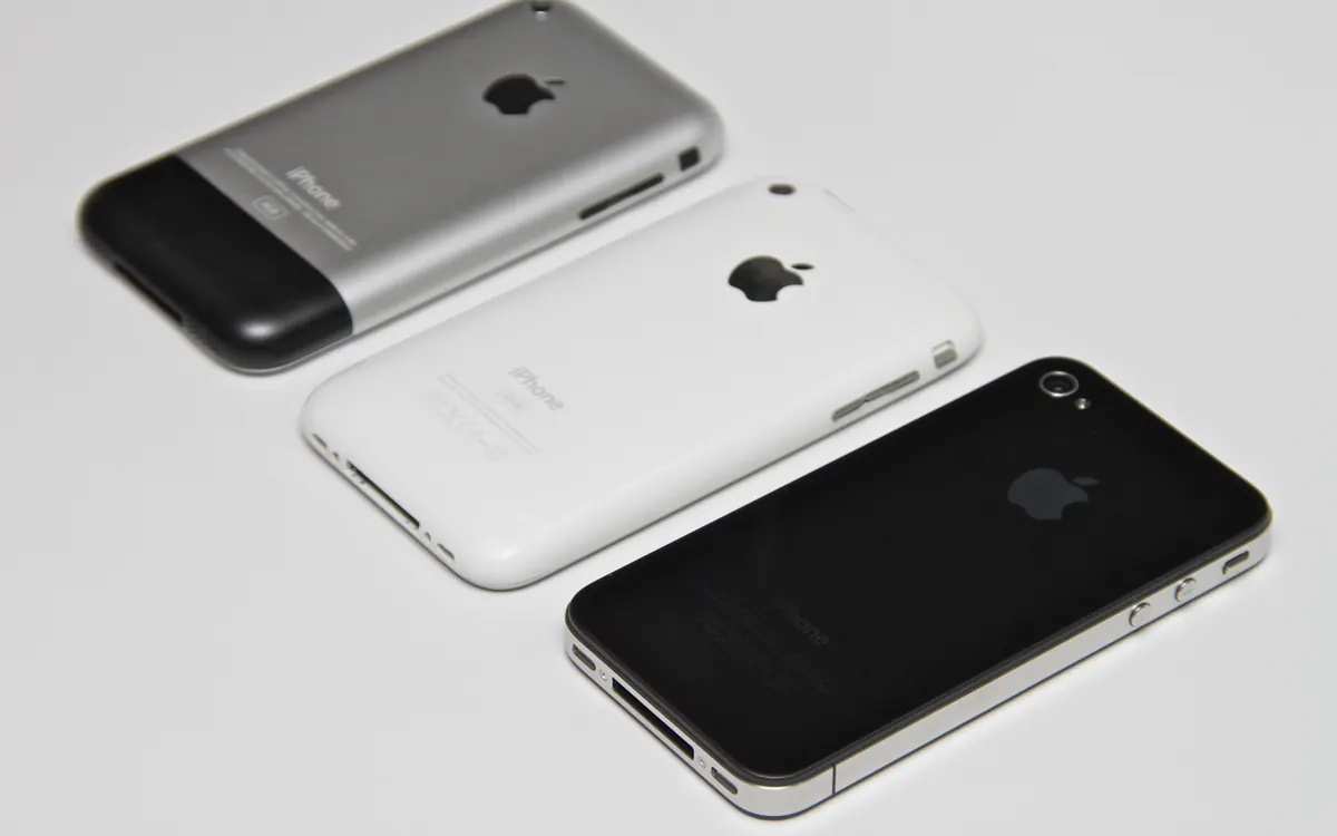 An original iPhone, an iPhone 3G and an iPhone 4 side by side (illustrative photo of legacy Apple devices)