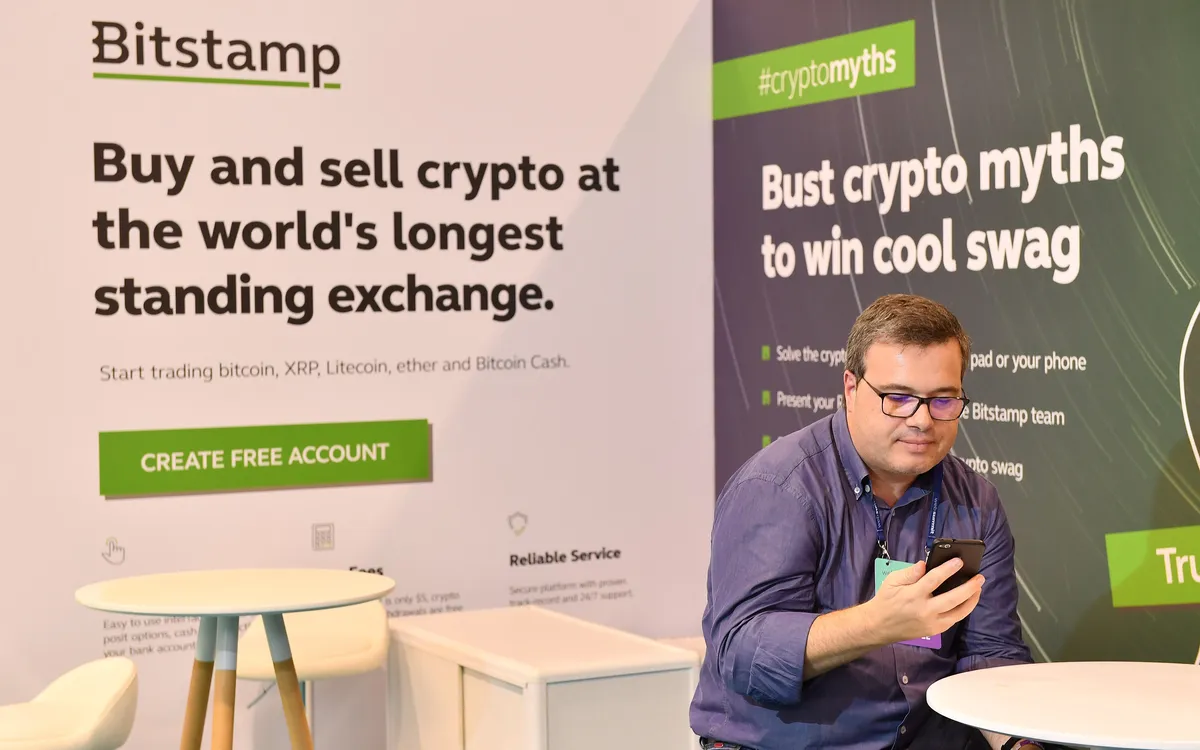 A visitor at the Bitstamp exchange booth at Web Summit 2018 in Lisbon (illustrative photo)