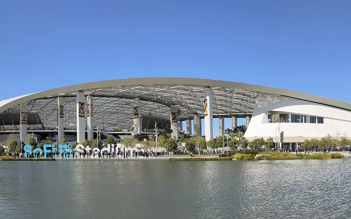 SoFi Stadium in Inglewood, California, seen across a lake on a sunny day (illustrative photo)