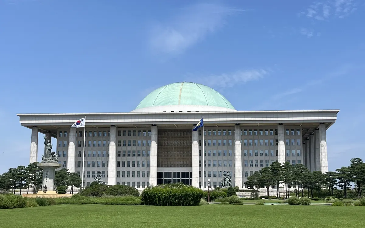 The domed National Assembly Building in Yeouido, Seoul, under a blue sky (illustrative photo)