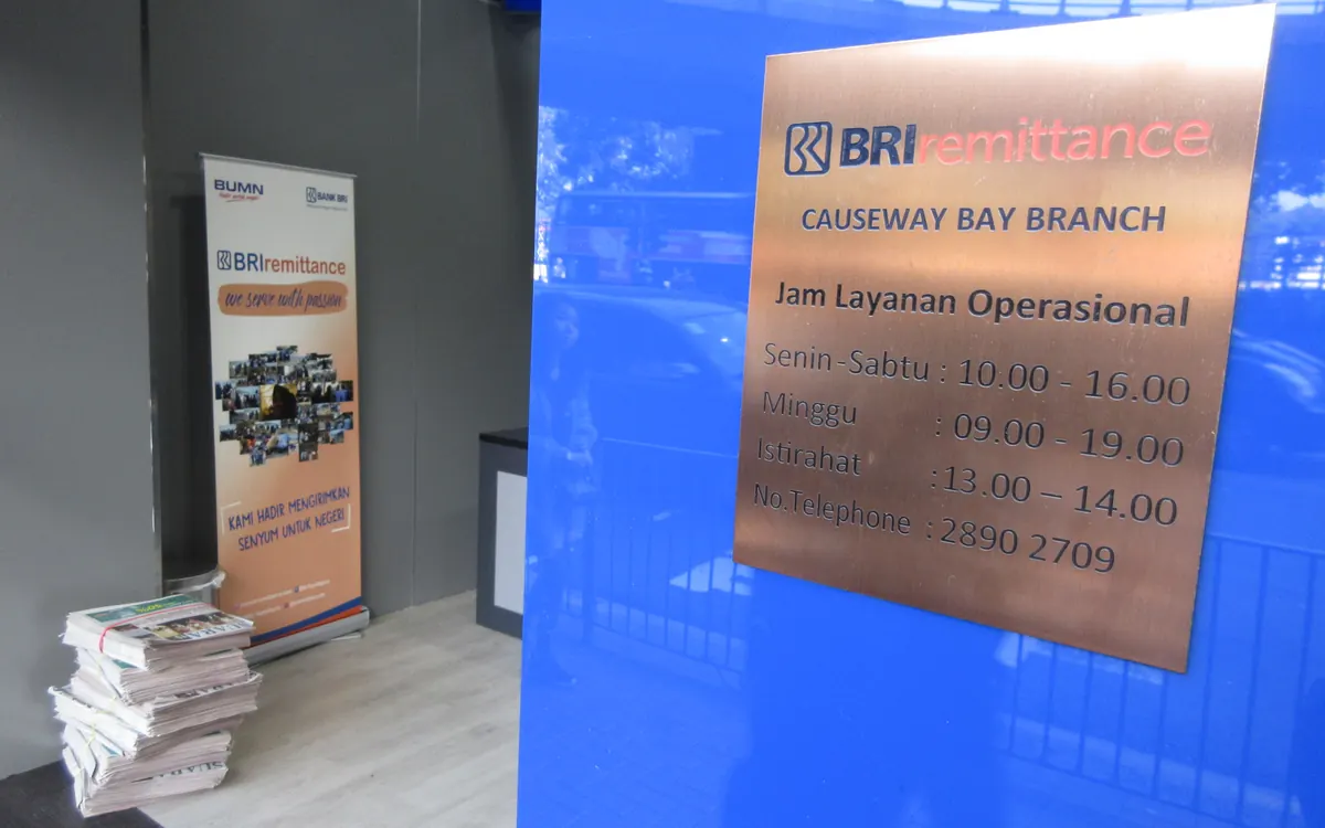 Opening-hours sign of a remittance company branch in Causeway Bay, Hong Kong (illustrative photo)