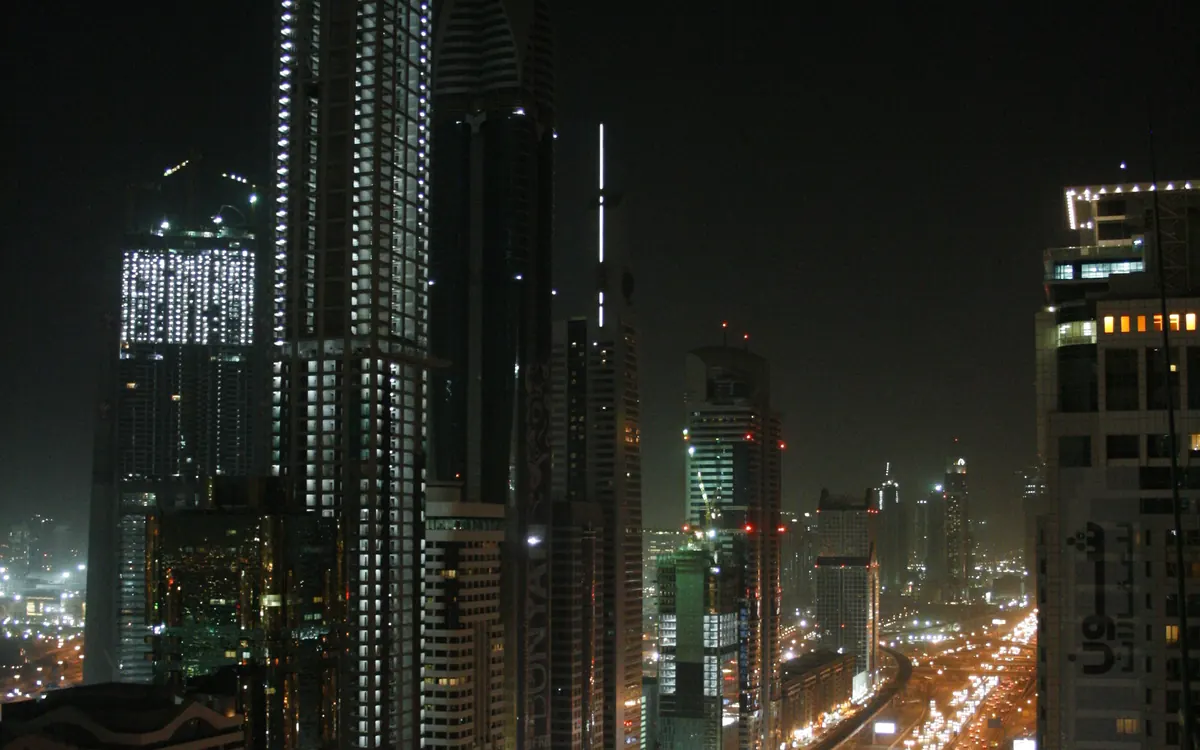 Sheikh Zayed Road towers in Dubai at night (illustrative photo)