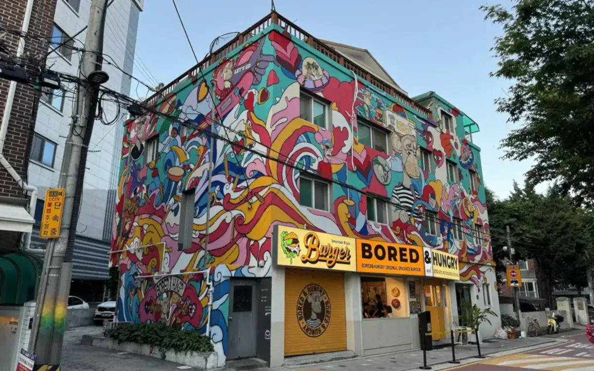 A colourfully painted building housing Bored & Hungry, a Bored Ape-themed burger restaurant (illustrative photo)